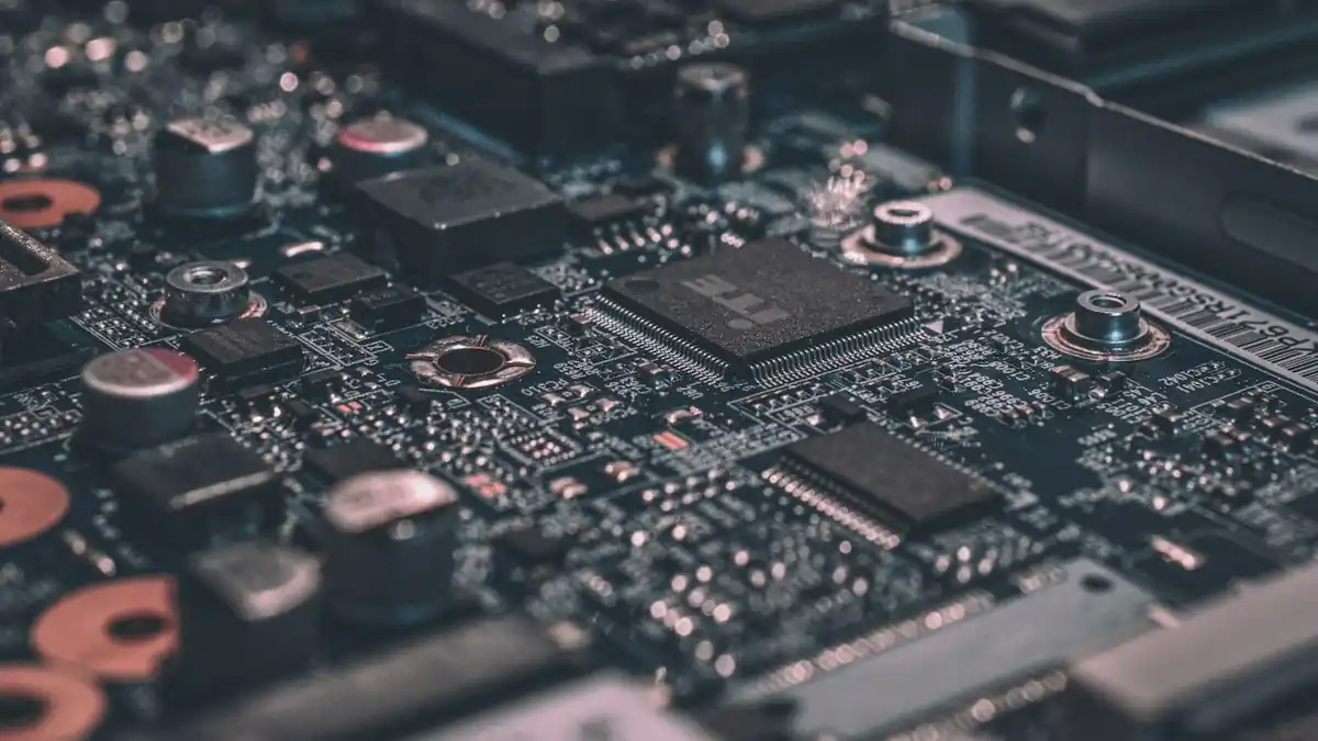 Close-up of a populated printed circuit board with integrated circuits and capacitors for electronic assemblies and membrane keypad suppliers