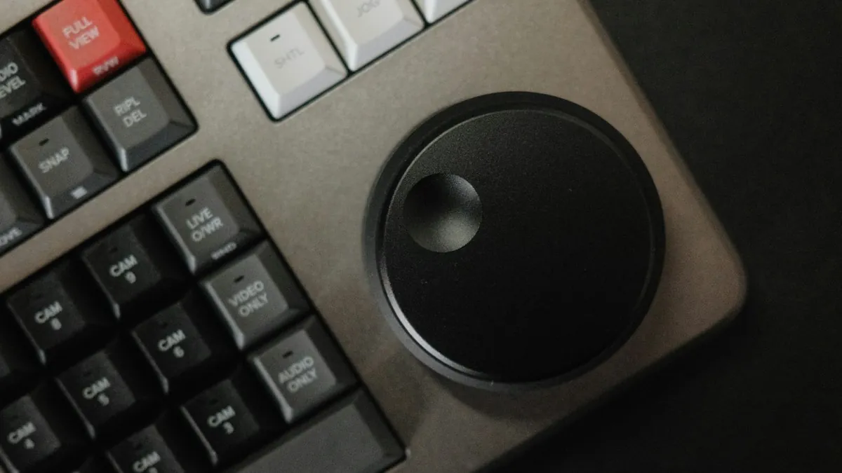Close-up of a control panel keypad with tactile feedback buttons and a rotary knob